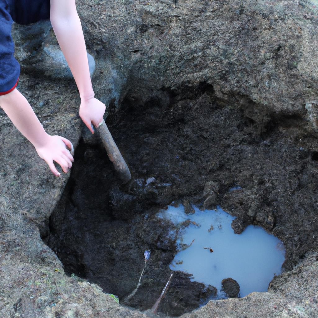 Person digging a pond hole