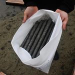 Person holding pond liner materials